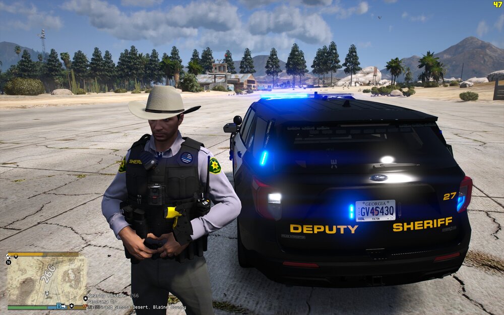 Could contain: outdoor, text, vehicle, land vehicle, sky, clothing, tire, wheel, person, vehicle registration plate, car, ground, law enforcement, police