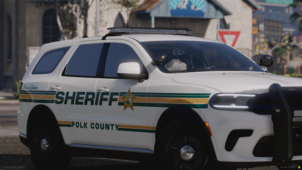 Could contain: text, vehicle, land vehicle, wheel, outdoor, transport, police car, law enforcement, police, car, full-size car, ford, emergency vehicle, tire, emergency service, police van, street