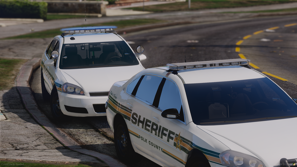 Could contain: vehicle, land vehicle, outdoor, wheel, car, transport, text, tire, police car, motorsport, road, auto part, ford, automotive exterior, full-size car, racing, automotive light bulb, ground, police, street