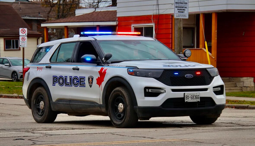 Could contain: land vehicle, vehicle, wheel, tire, outdoor, transport, car, ford, text, police car, sport utility vehicle, bumper, auto part, compact sport utility vehicle, ford motor company, emergency vehicle, law enforcement, vehicle registration plate, police, emergency service, crossover suv, mitsubishi, nissan, street