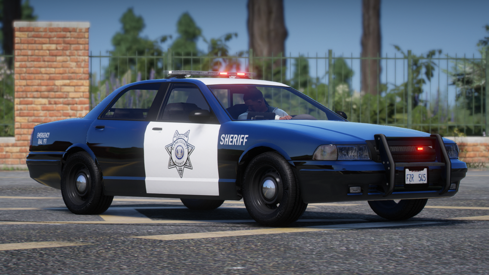 Could contain: vehicle, land vehicle, wheel, outdoor, transport, car, tire, full-size car, law enforcement, police car, text, ford crown victoria police interceptor, police, sedan, road, bumper