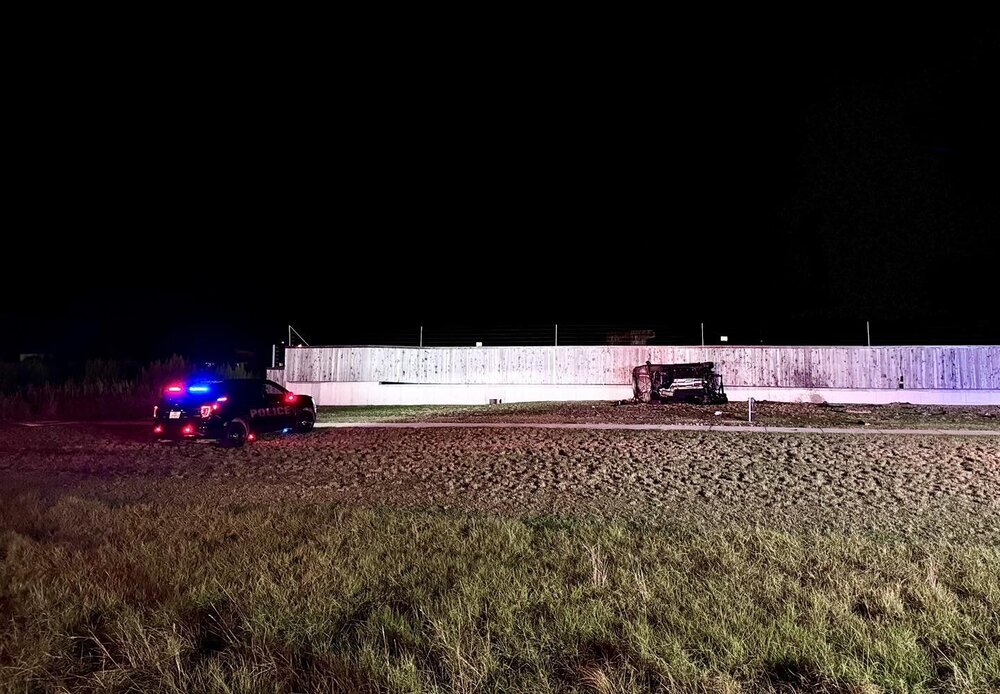 Could contain: outdoor, grass, field, vehicle, land vehicle, sky, ground, night, light
