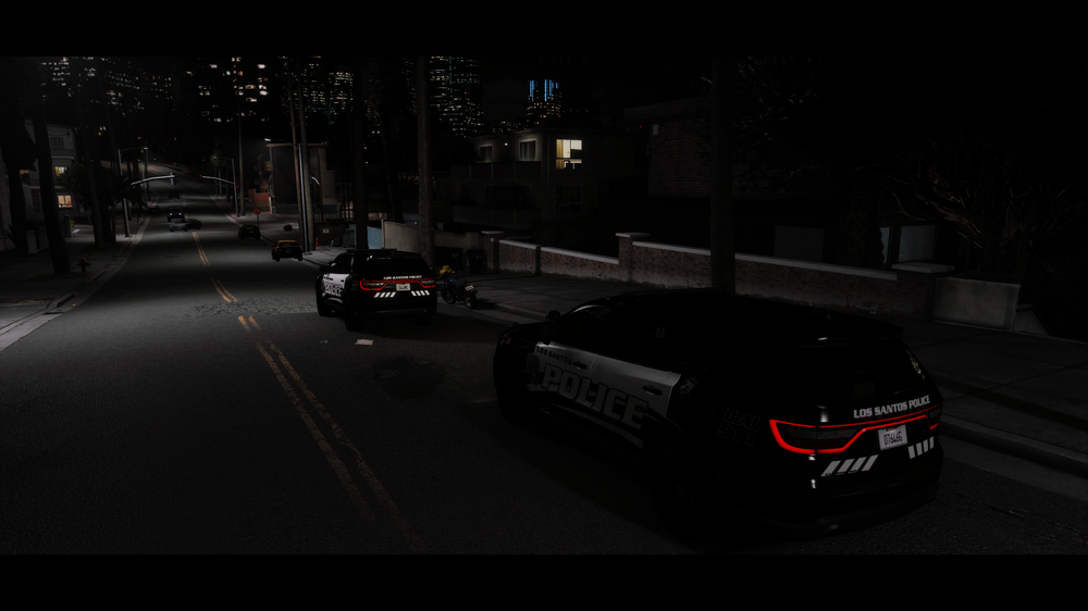 Could contain: vehicle, land vehicle, outdoor, road, wheel, car, luxury vehicle, street, light, dark, city, night