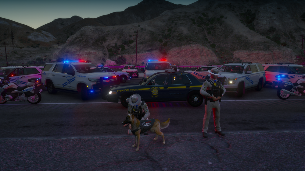 Could contain: vehicle, land vehicle, outdoor, wheel, road, tire, mountain, sky, ground, group, people, parked, car, parking