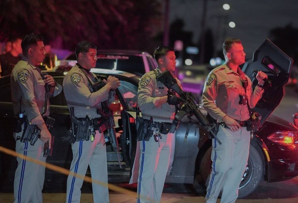 Could contain: clothing, person, concert, outdoor, man, group, people, standing