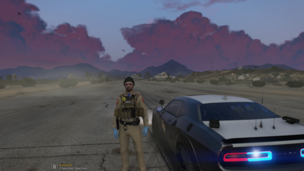 Could contain: vehicle, outdoor, land vehicle, cloud, sky, wheel, road, tire, mountain, person, ground, desert, car