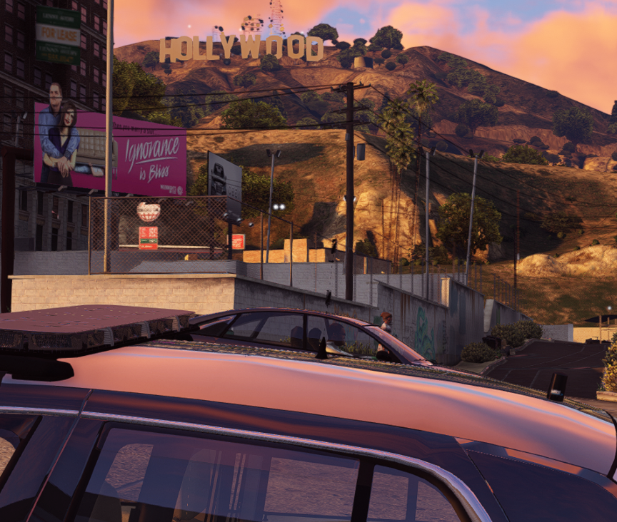 Could contain: outdoor, vehicle, land vehicle, sky, cloud, building, automotive carrying rack, car, mountain, travel, sunset, parked, landscape