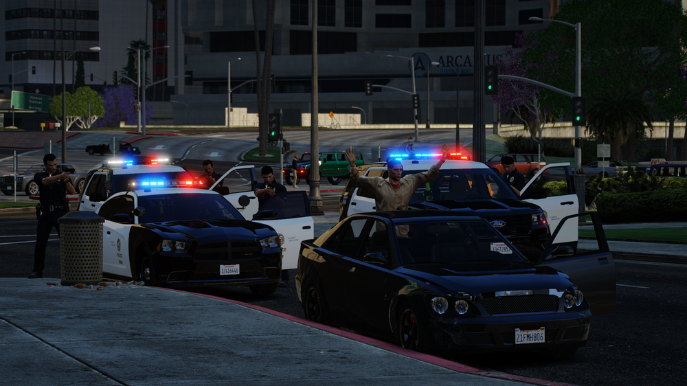 Could contain: land vehicle, vehicle, outdoor, wheel, building, road, transport, car, tire, street, police, light