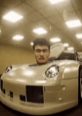 Could contain: land vehicle, vehicle, car, wheel, human face, bumper, tire, automotive design, auto part, hood, man, person, automotive lighting, indoor, ceiling, roof