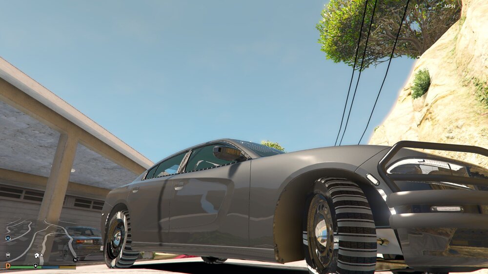 Could contain: wheel, outdoor, vehicle, land vehicle, sky, tire, auto part, automotive design, luxury vehicle, car, ground, parked, truck, silver