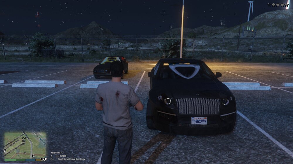 Could contain: clothing, outdoor, ground, vehicle, person, car, man, land vehicle, road, spacecraft, night