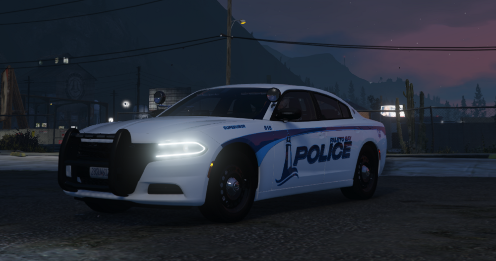 Could contain: vehicle, land vehicle, transport, car, outdoor, wheel, full-size car, mid-size car, road, automotive design, automotive light bulb, police, street