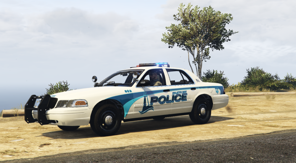 Could contain: vehicle, land vehicle, outdoor, transport, sky, wheel, police, car, tire, police car, ford crown victoria police interceptor, law enforcement, ground, blue