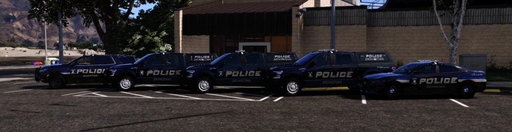 Could contain: vehicle, land vehicle, outdoor, wheel, tire, building, road, auto part, law enforcement, police, transport, car, blue, parked, street