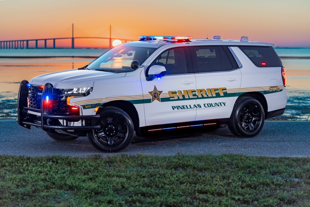 Could contain: vehicle, land vehicle, wheel, transport, outdoor, tire, emergency vehicle, text, emergency service, police car, law enforcement, bumper, ford, emergency, motor vehicle, police, car