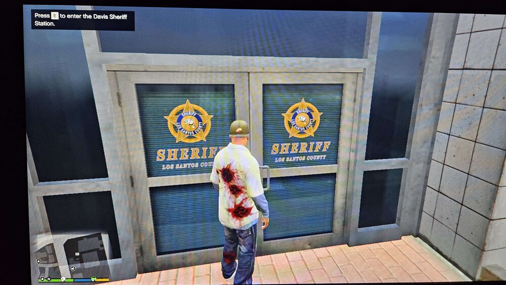 Could contain: clothing, text, screenshot, footwear, door, pc game, person