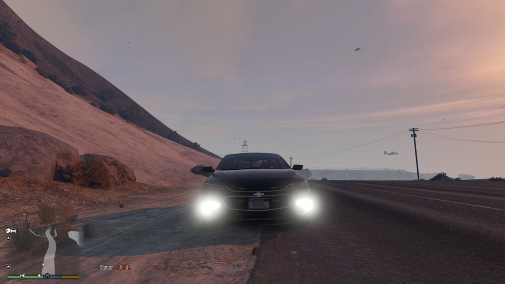 Could contain: outdoor, sky, vehicle, land vehicle, road, cloud, ground, highway, mountain, driving, car, landscape