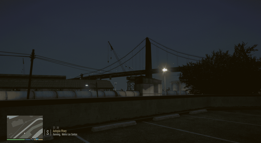 Could contain: outdoor, sky, electricity, tree, night, road, light, bridge