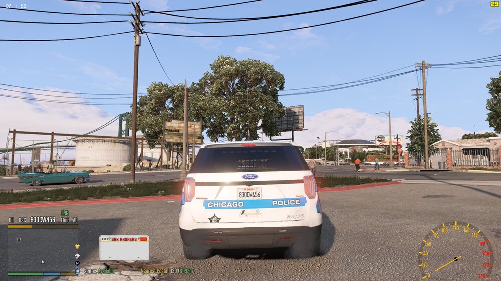 Could contain: outdoor, sky, vehicle, text, land vehicle, vehicle registration plate, tree, wheel, car, road, tire, street, ground