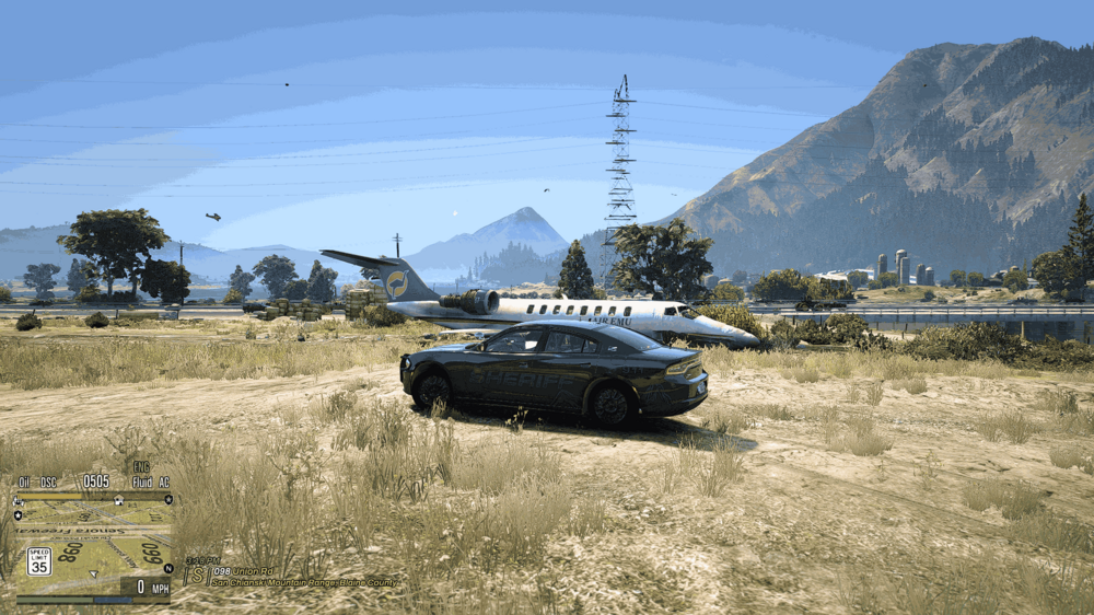 Could contain: outdoor, car, sky, vehicle, land vehicle, mountain, grass, wheel, ground