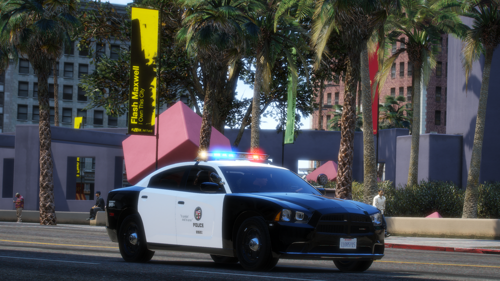 Could contain: vehicle, land vehicle, outdoor, wheel, transport, tree, mid-size car, road, full-size car, police, street, police car, sports sedan, car, law enforcement, driving