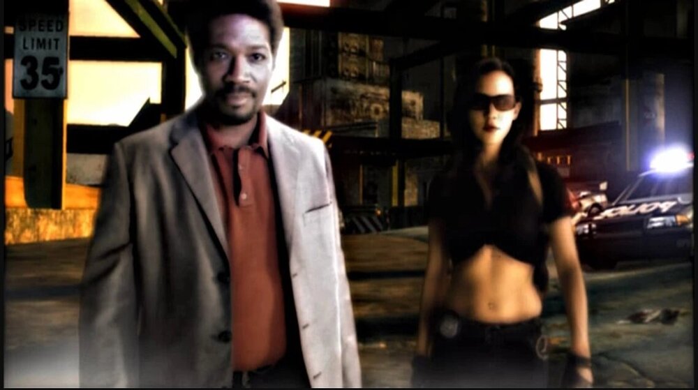 Could contain: clothing, person, human face, building, man, screenshot, street, standing, wearing, suit, outdoor