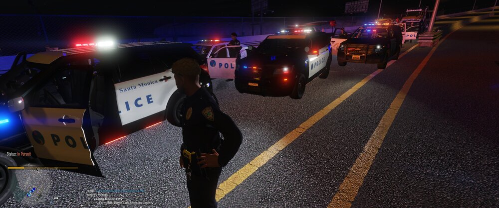 Could contain: outdoor, vehicle, road, car, land vehicle, text, street, ground, night, sign, light, person, police