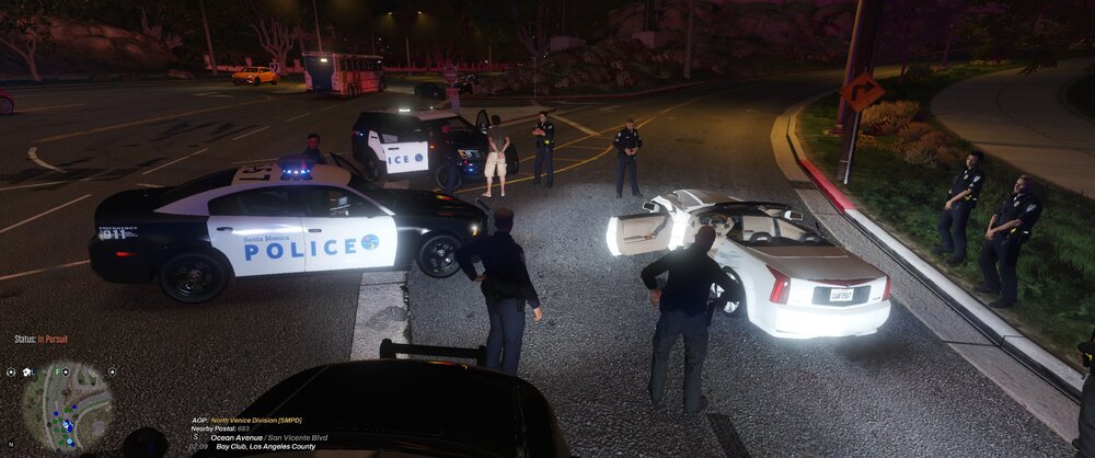 Could contain: vehicle, land vehicle, text, outdoor, wheel, road, tire, car, police, person, ground, street