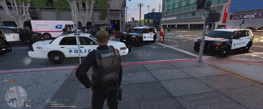 Could contain: vehicle, land vehicle, text, outdoor, clothing, wheel, tire, person, road, vehicle registration plate, footwear, family car, street, car, police, ground