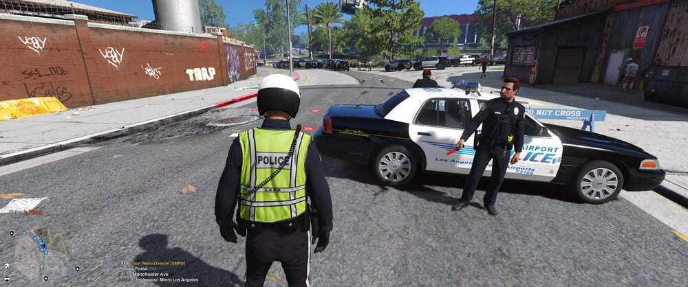 Could contain: outdoor, vehicle, land vehicle, wheel, sky, clothing, tire, text, car, road, person, police, ground, street, officer