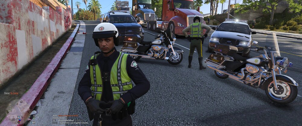 Could contain: outdoor, land vehicle, vehicle, wheel, motorcycle, road, clothing, person, tire, tree, auto part, helmet, asphalt, street, police