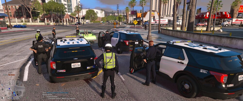 Could contain: outdoor, vehicle, land vehicle, wheel, sky, car, tire, road, tree, text, transport, motor vehicle, traffic, police, ground, street, officer