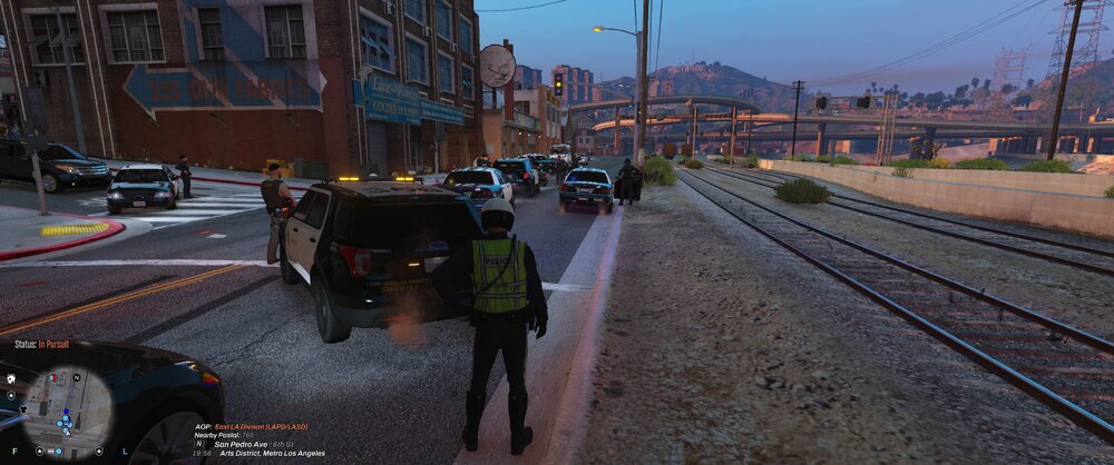 Could contain: outdoor, vehicle, land vehicle, sky, building, car, wheel, ground, track, screenshot, way, railroad, street