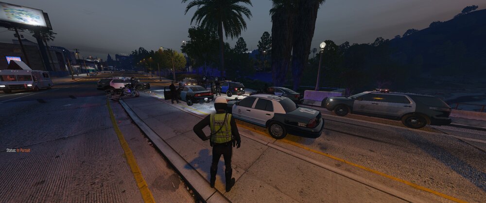 Could contain: land vehicle, vehicle, outdoor, sky, tree, car, road, way, person, ground, track, street