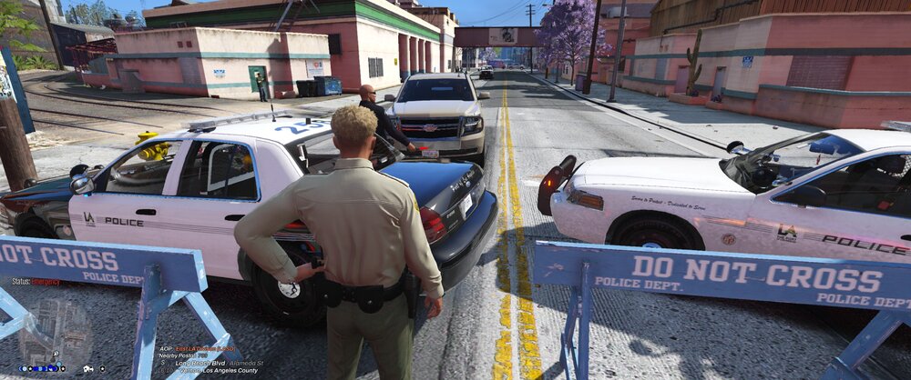 Could contain: outdoor, vehicle, land vehicle, text, clothing, wheel, building, tire, person, car, man, ground, motorsport, road, people