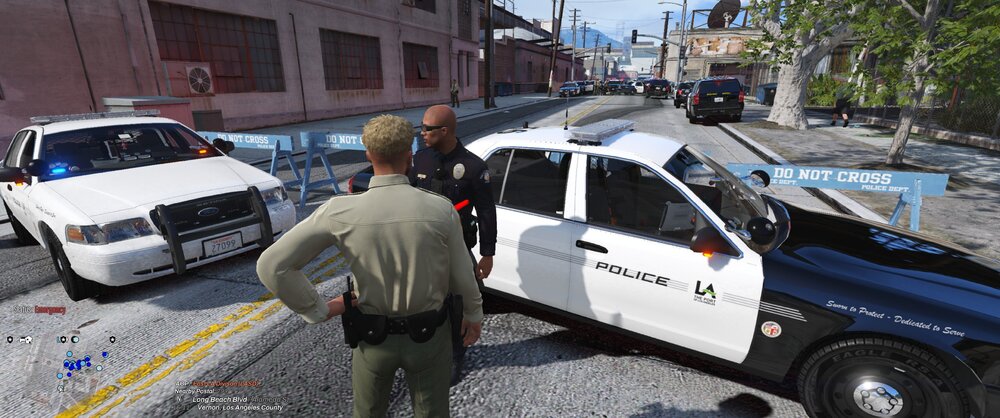 Could contain: vehicle, land vehicle, outdoor, wheel, tire, transport, car, truck, auto part, law enforcement, motor vehicle, clothing, man, automotive exterior, road, police, person, street, ground, van, officer