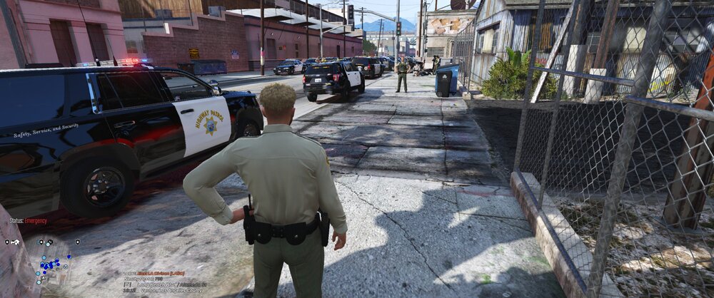 Could contain: outdoor, vehicle, land vehicle, tire, wheel, clothing, car, building, person, ground, man, footwear, auto part, truck, street