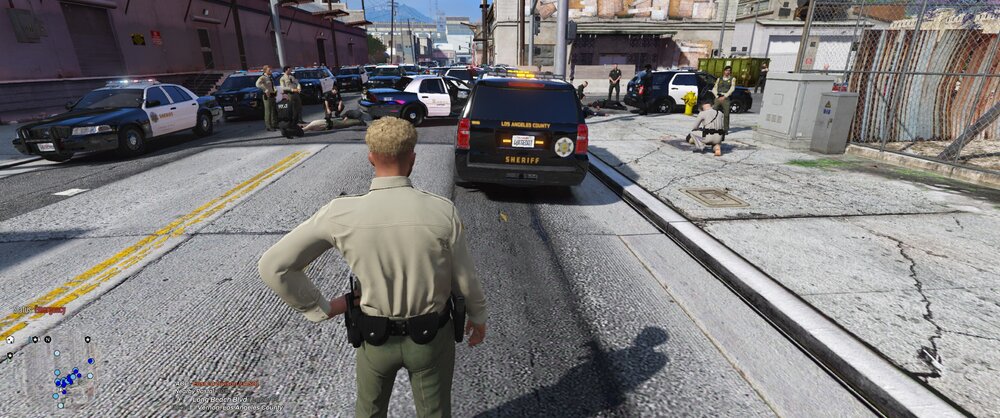 Could contain: outdoor, clothing, vehicle, land vehicle, way, car, ground, sky, man, road, building, footwear, person, wheel, road surface, truck, text, street, city, sidewalk