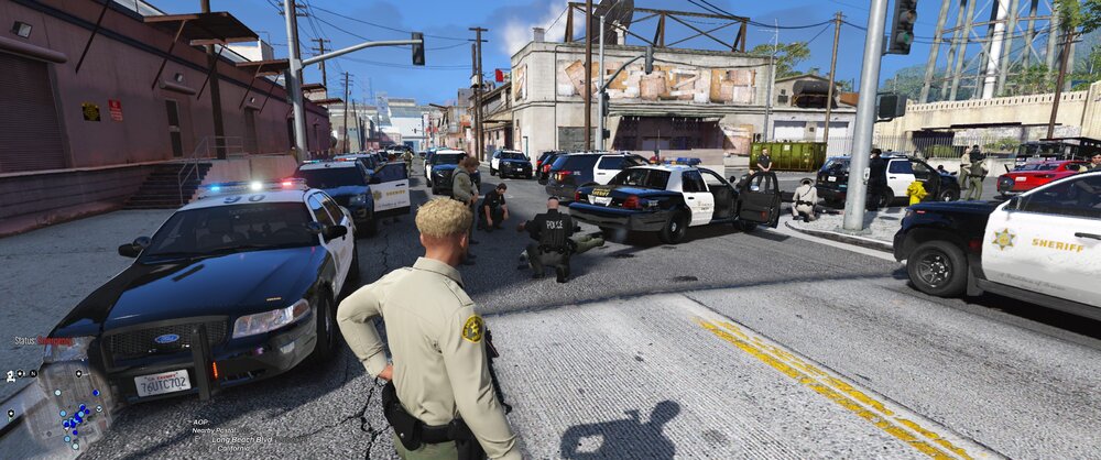 Could contain: outdoor, land vehicle, vehicle, wheel, sky, text, road, clothing, vehicle registration plate, tire, way, building, auto part, person, traffic, family car, asphalt, motor vehicle, man, road surface, automotive exterior, officer, police, street, city, car