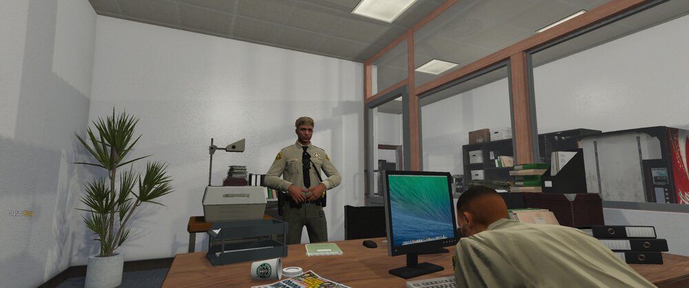 Could contain: indoor, wall, computer, furniture, office building, desk, computer monitor, table, man, interior design, person, room, ceiling, office, floor