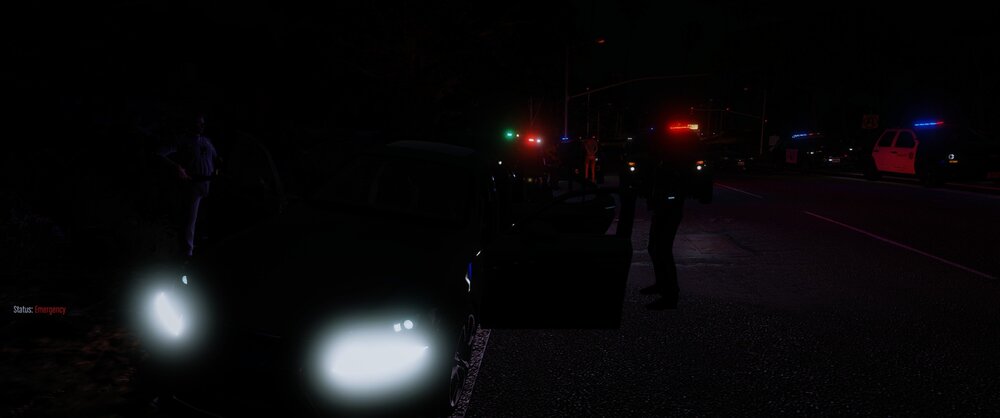 Could contain: outdoor, darkness, road, street light, night, light, street, dark, people