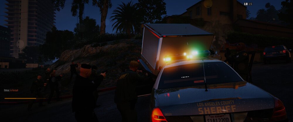 Could contain: outdoor, vehicle, land vehicle, transport, building, automotive lighting, road, person, car, rally, street, people, night, dark, light