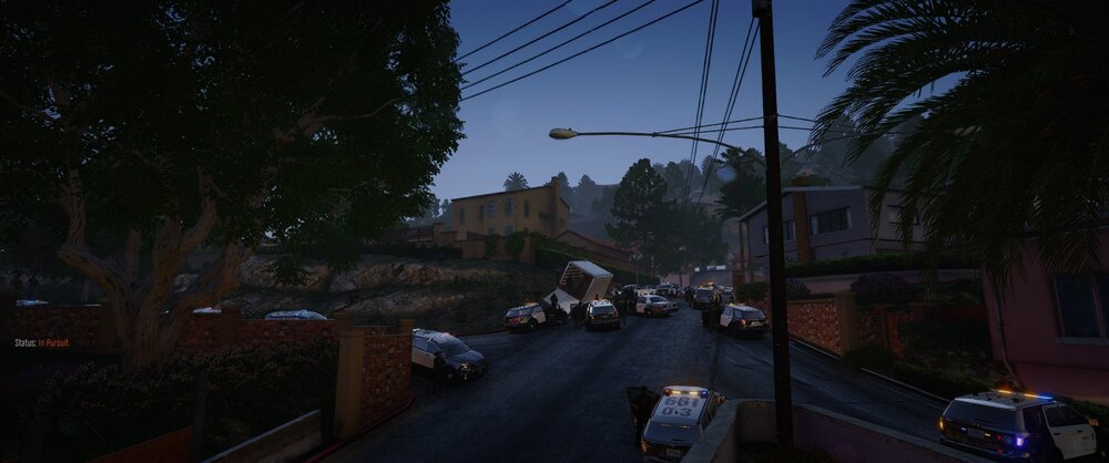 Could contain: outdoor, sky, tree, house, vehicle, land vehicle, road, electricity, car, neighbourhood, street light, town, way, city, street, travel