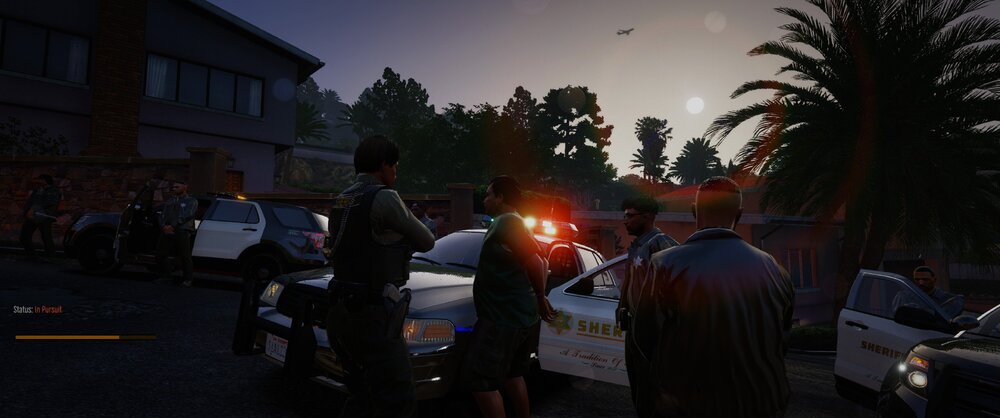 Could contain: outdoor, sky, land vehicle, vehicle, tree, car, man, person, wheel, clothing, tire, road, auto part, people, street, light