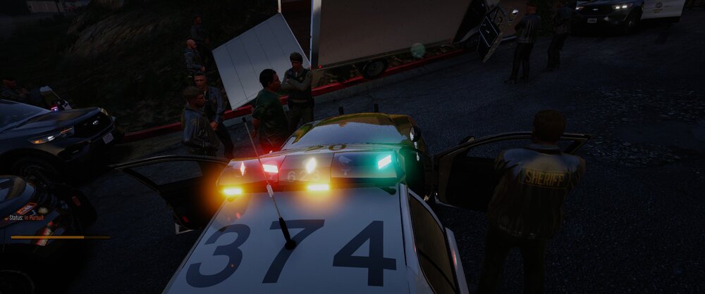 Could contain: vehicle, land vehicle, outdoor, screenshot, road, street, ground, light, rally, night, car