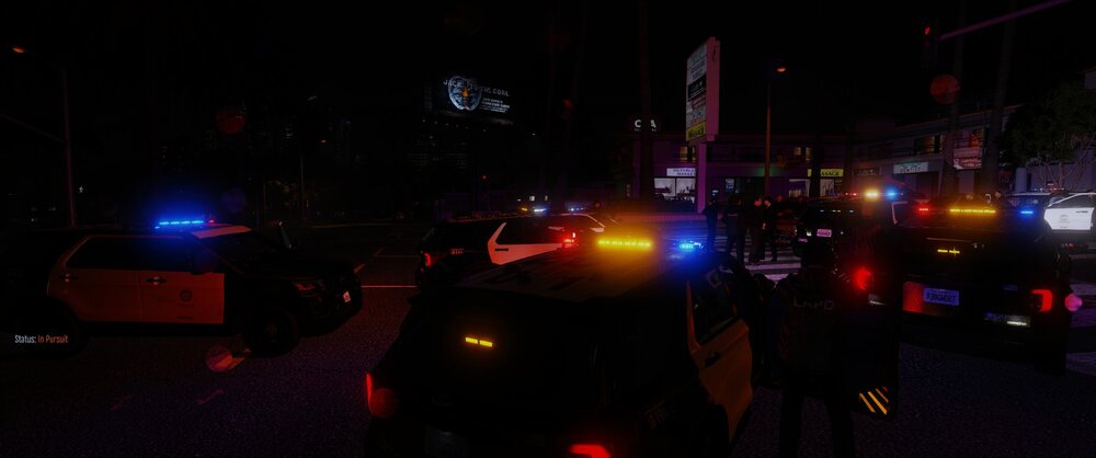 Could contain: outdoor, night, vehicle, car, land vehicle, street, darkness, electricity, city, people, dark, person, light