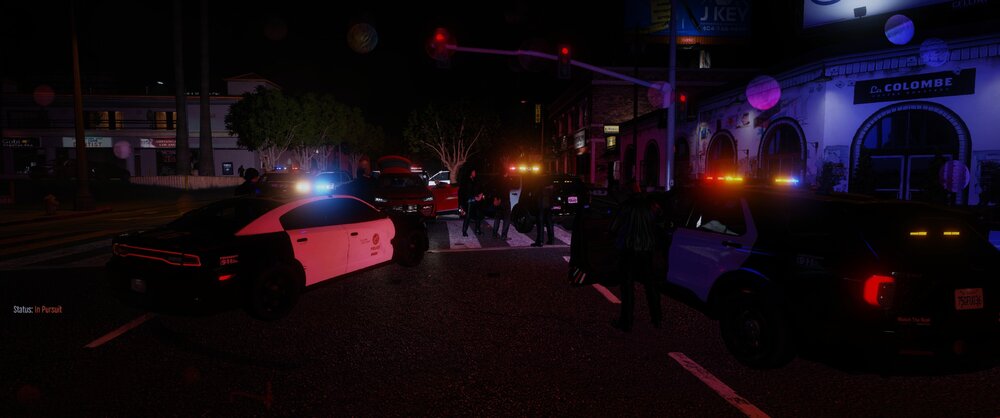 Could contain: outdoor, vehicle, land vehicle, street light, darkness, night, light, street, dark, parked