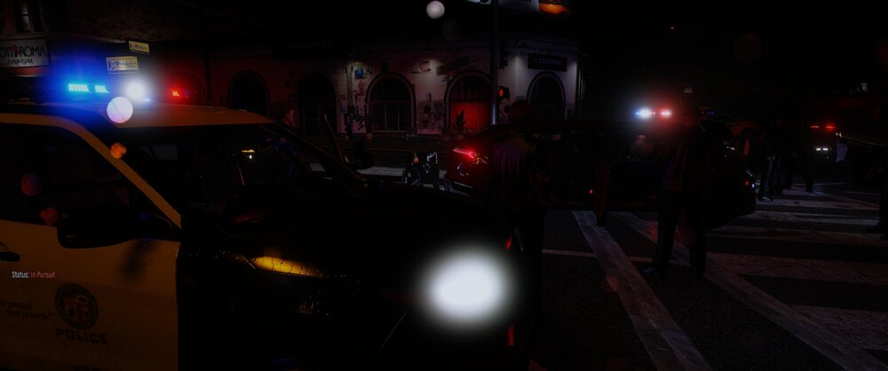 Could contain: vehicle, land vehicle, outdoor, night, car, street, light, darkness, transport, city, people, traffic light