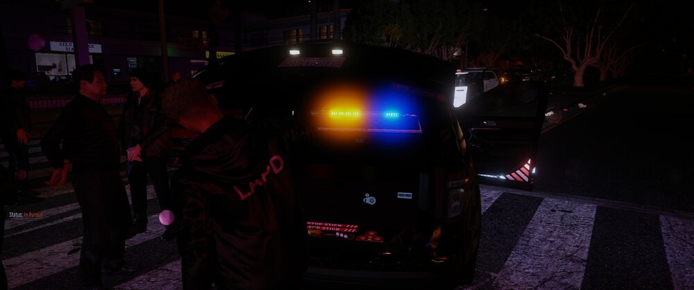 Could contain: outdoor, vehicle, land vehicle, car, person, night, street, ground, people, city