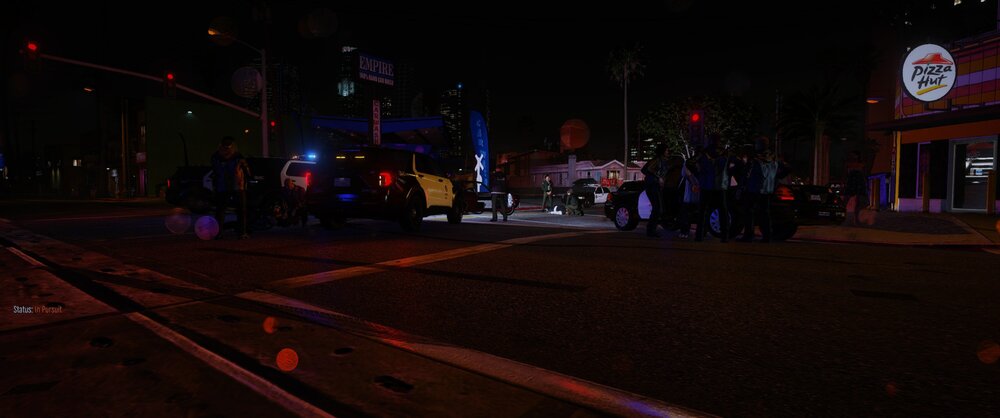 Could contain: outdoor, night, sky, building, electricity, road, street, neon, darkness, street light, light, city